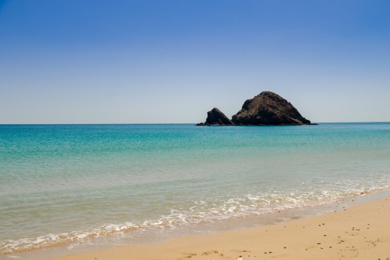 fujairah beach with a view of snoopy island for a short trip from dubai