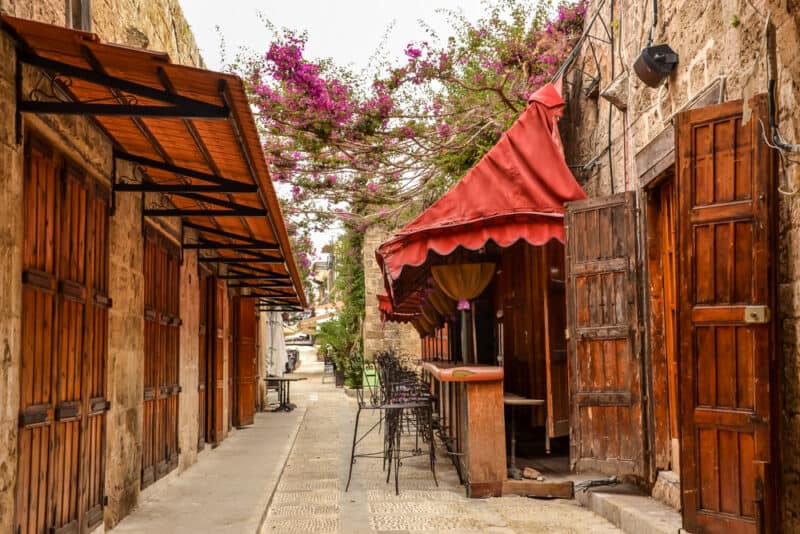 Beautiful street with red canopies and wooden shutters in Byblos Lebanon