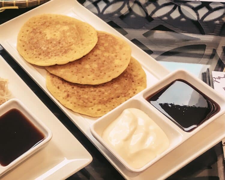 Emirati breakfast pancakes served with date syrup and cheese spread