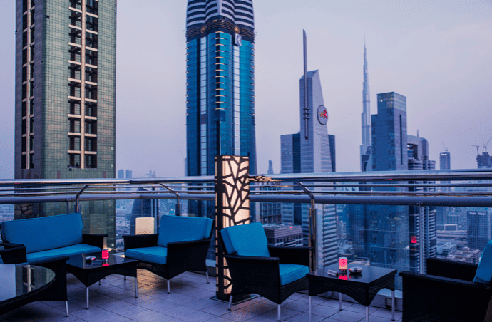 Dusk view from the open air rooftop coacktail lounge Level 43 at Trade Centre area in Dubai where the Burj Khalifa is visable