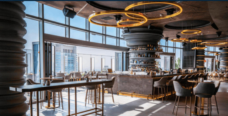Inside the restaurant at Ce La Vie in Dubai with a partial view to the terrace outside and bar area