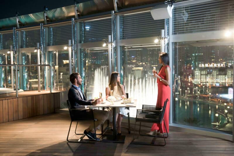 Inside the Burj Club, a couple having dinner with a view of the Dubai Fountain