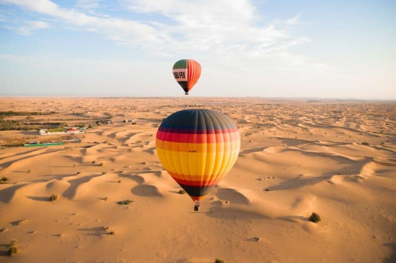 Hot air balloons flying over the desert in Dubai