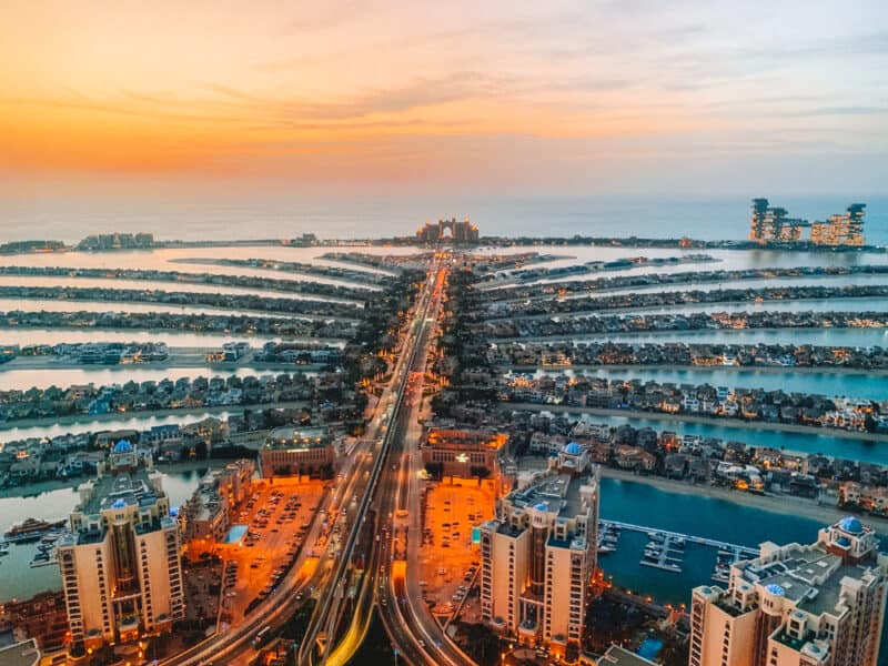 The sun setting on the view from The View at The Palm, looking towards the end of the Palm Jumeirah with Atlantis and Royal Atlantis