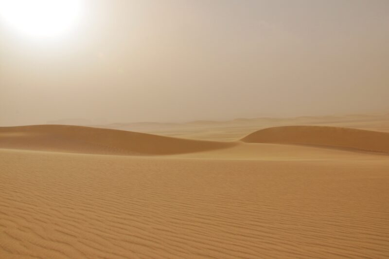 The Dubai desert during Summer with the sun looking hazy