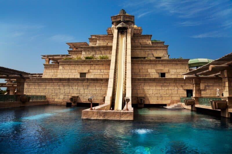 The famous Leap of Faith slide at Atlantis with it's imitation Aztec architecture and slide that comes out a bird mouth into a blue lagoon