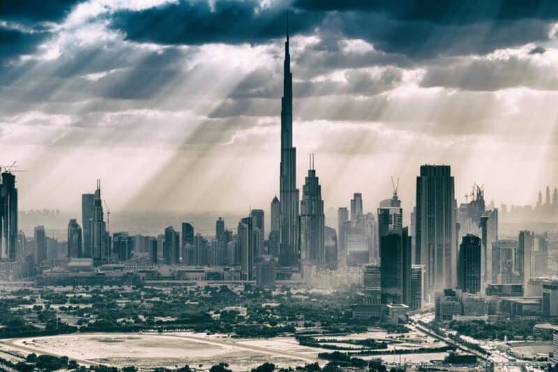 Clouds with beams of light breaking through with a view of the Burj Khalifa, looking dark and about to rain