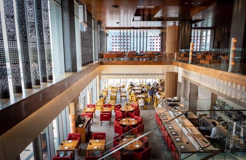 Inside the interiors of Zuma Dubai, looking down into the restaurant area from the bar