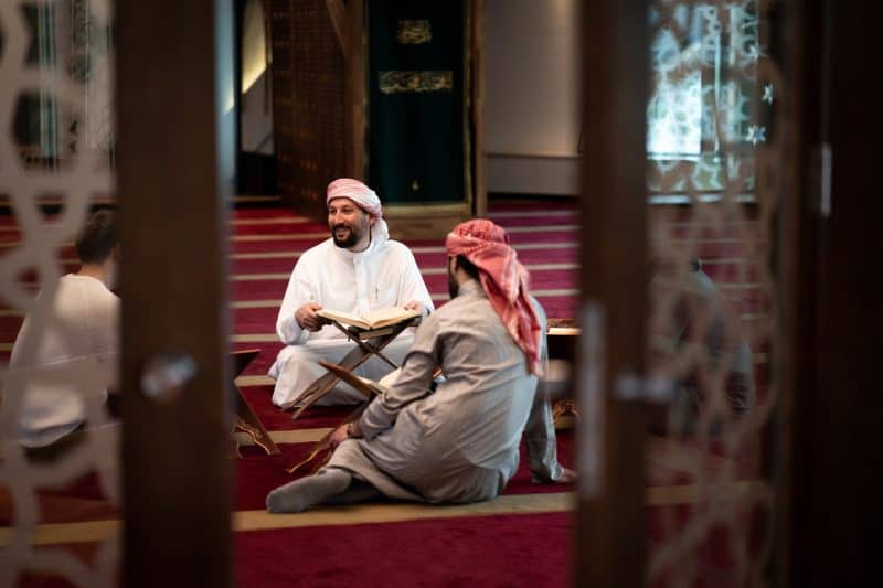 Group of Muslim men attending an Islamic class in a masjid. Classes can be a great way to meet other Muslims.