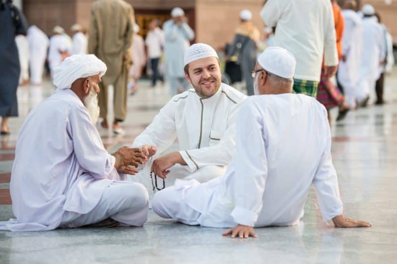 Muslims from all different background chatting to each other and sharing their Islamic faith. Reaching out to the community as a Muslim.