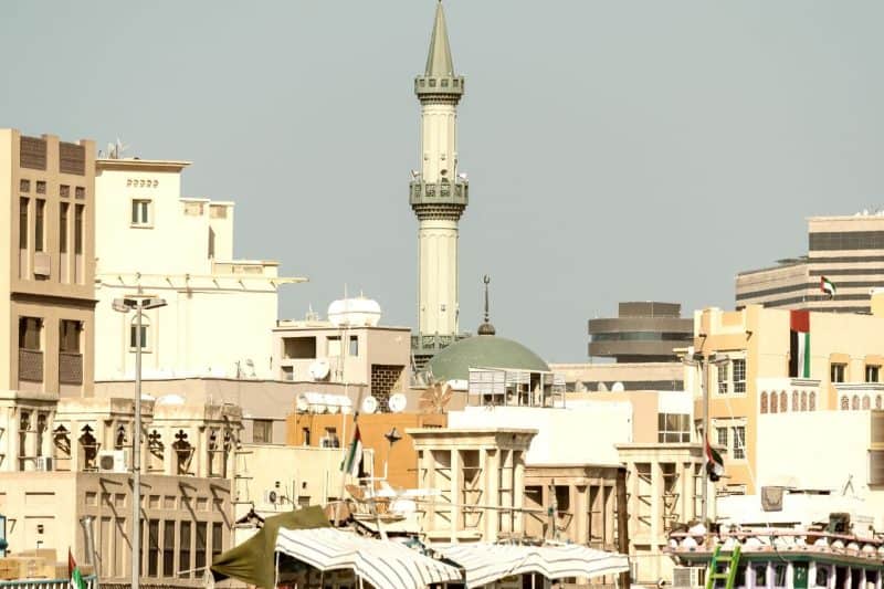 photo of the rooftops of Dubai's historic Deira area feauturing a mosque and old Dubai buildings