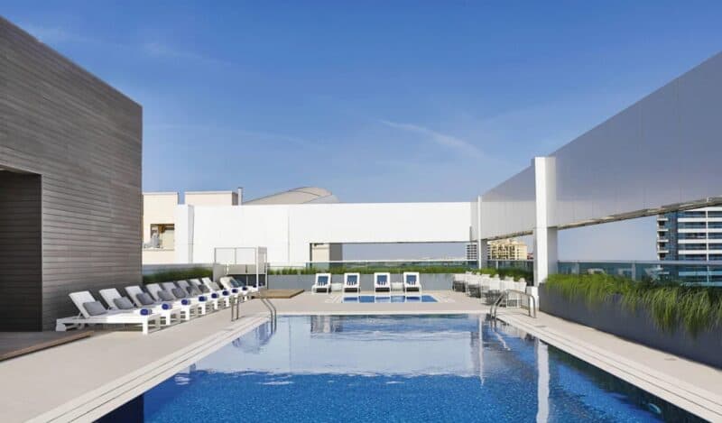 Rooftop swimming pool with a nice blue sky at Courtyard by Marriott Al Barsha