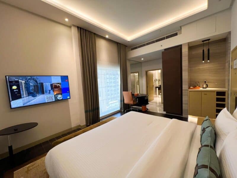 Modern interiors with a tv and large bed at Grayton Hotel by Blazon