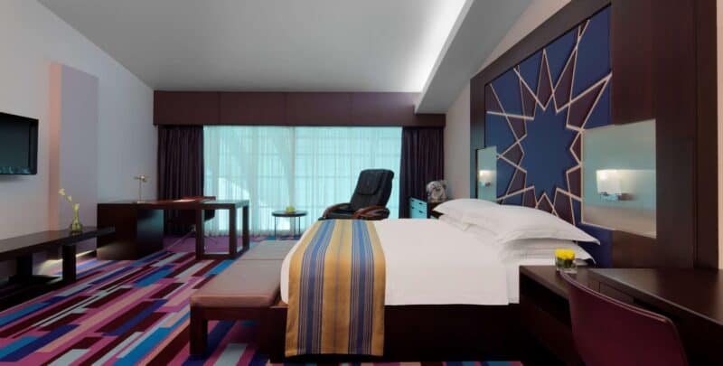 Inside a large double room at Dubai International Hotel with modern Arabic decor