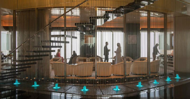 Burj Khalifa VIP lounge with water feature and guests enjoying the experience