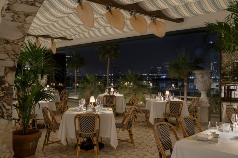 Outdoor terrace area with seating and vintage Italian riveria decor at Ristorante Loren