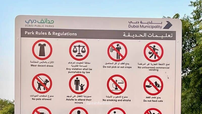 Dress code sign in Dubai Public Park with other rules for the park