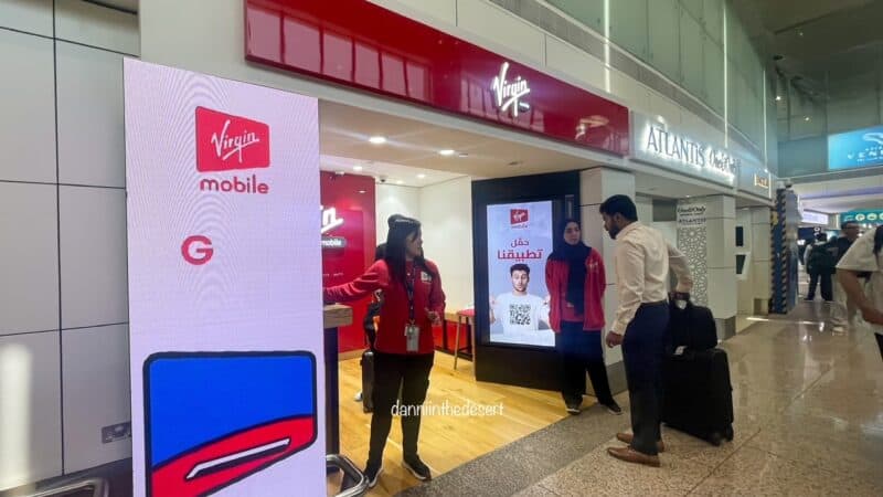 Staff from Virgin Mobile standing at the shop, waiting to help those arriving into Dubai Airport