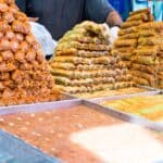 Arabic sweets laid out in a dessert shop in Dubai