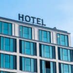 Exterior of a modern hotel building with large glass windows