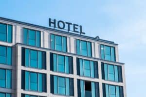 Exterior of a modern hotel building with large glass windows