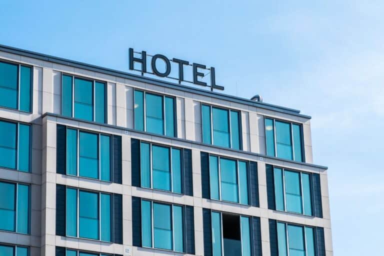 Exterior of a modern hotel building with large glass windows