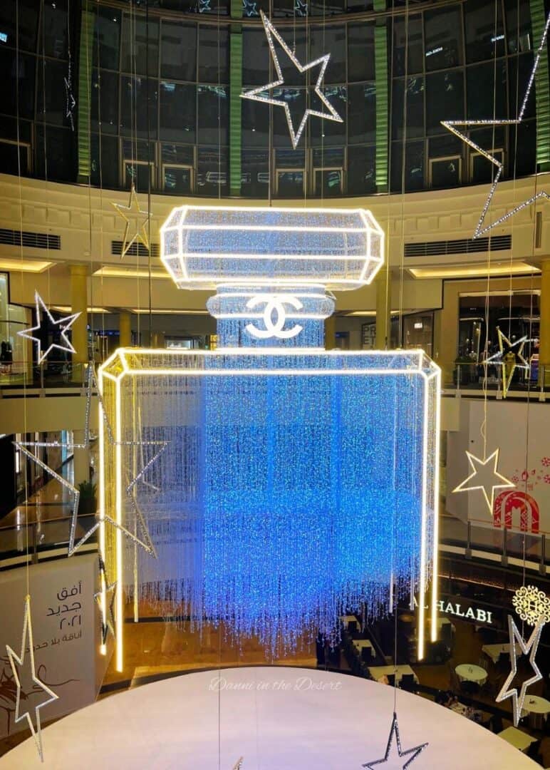 Chanel bottle Christmas themed lights hanging in Mall of Emirates in Dubai