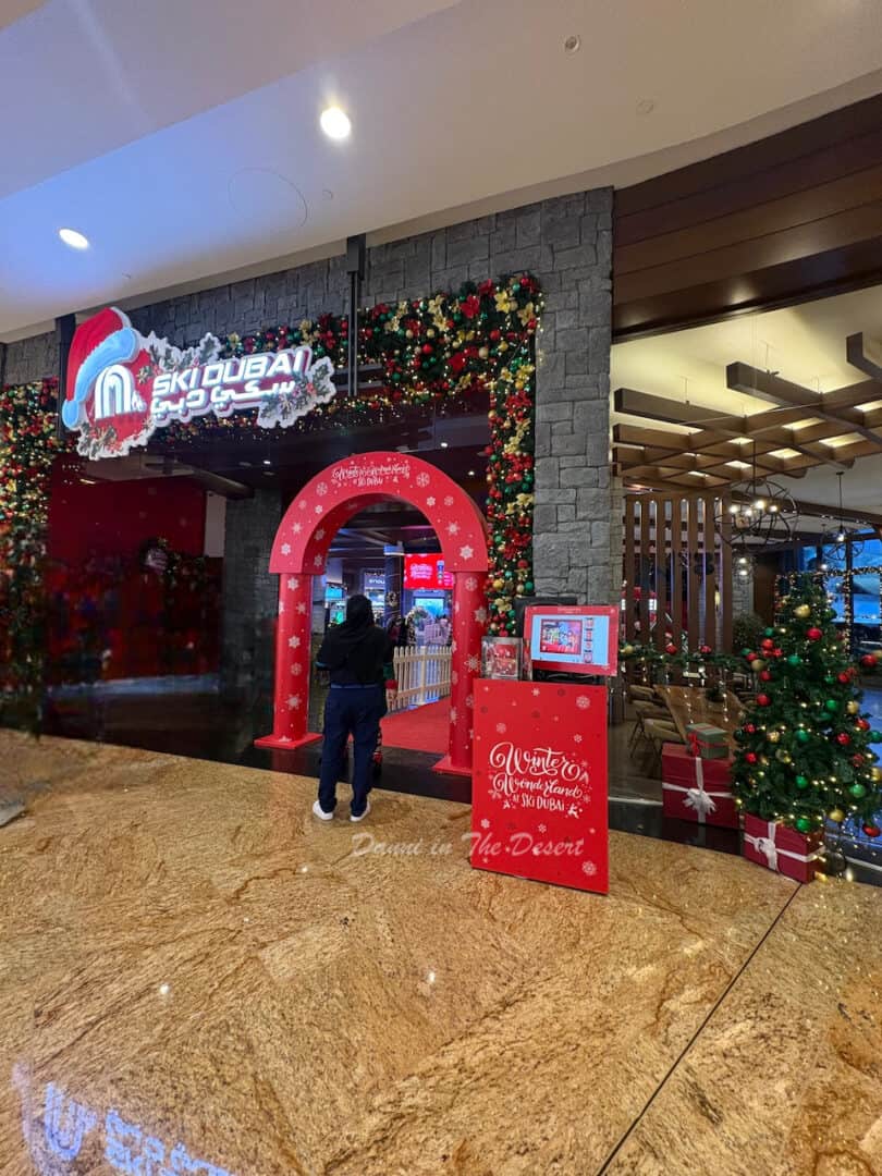 Entrance to Winter Wonderland and Ski Dubai from the Mall of Emirates with festive decorations and a Christmas tree