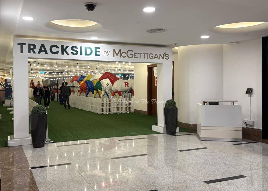 Entrance on the ground floor into the Trackside by McGettican's area with colourful horse sculptures inside