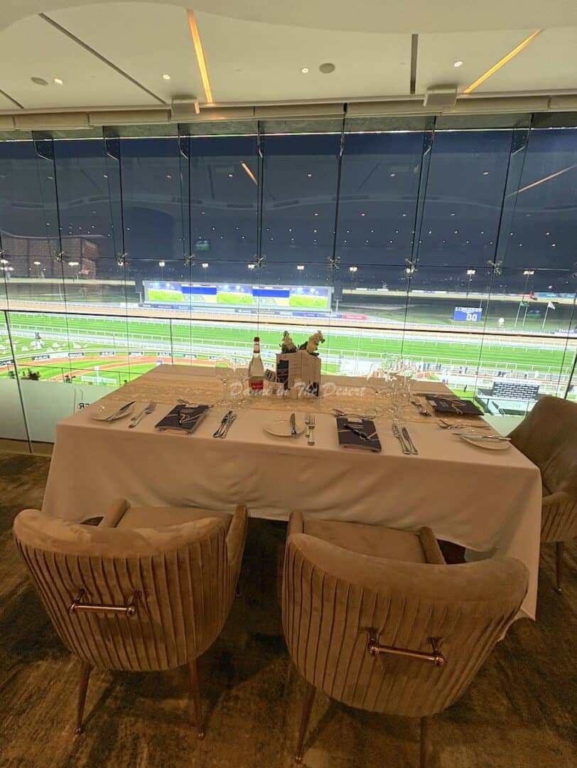 View of the race course from the Winner's Circle restaurant with seating and table laid out ready for guests to arrive