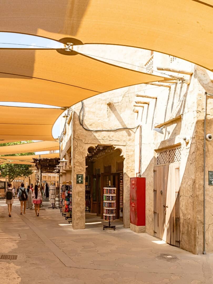 Souk Al Seef with it's historical style buildings and market stalls with tourists walking past the shops