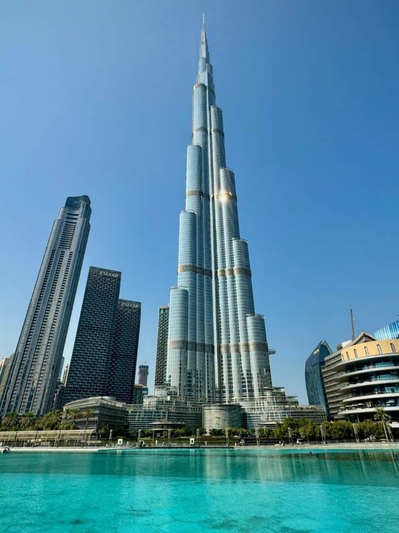 Burj Lake and Burj Khalifa as viewed from Burj Lake during the daytime with the sun glistening off Burj Khalifa's facade